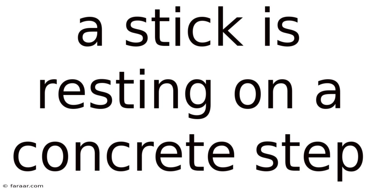 A Stick Is Resting On A Concrete Step